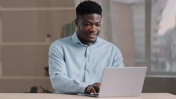 African American Businessman Professional Worker Male Programmer Man in Blue Shirt Working Freelance