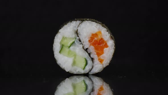 Sushi Roll Yin Yang on a Black Background