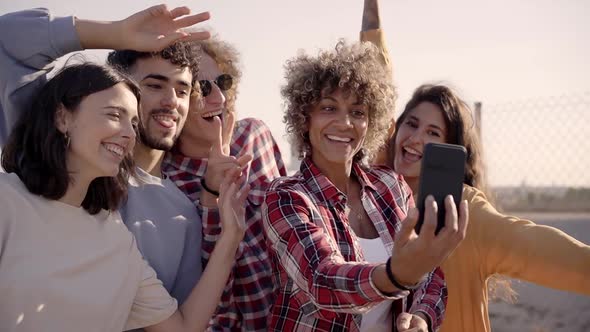 Group of Multiracial Happy Friends Taking Selfie and Having Fun Together