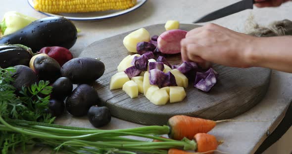 woman cut colors  potatoes
