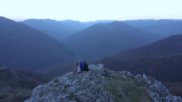 Group of Friends Wandering on a Mountain Cliff