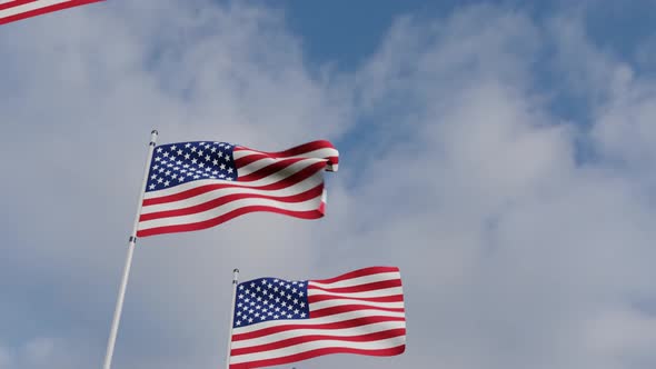 Waving Flags Of The United States and blue sky