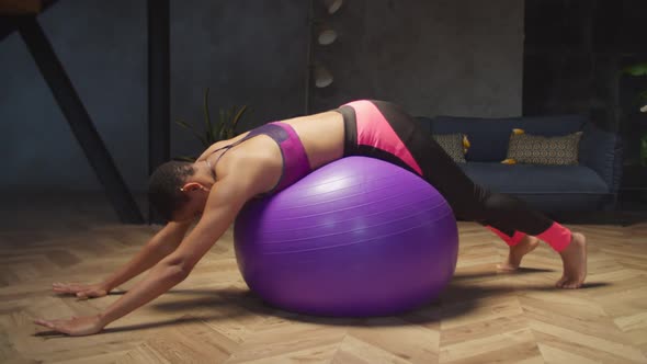 Healthy Fit Woman Exercising with Fitball at Home