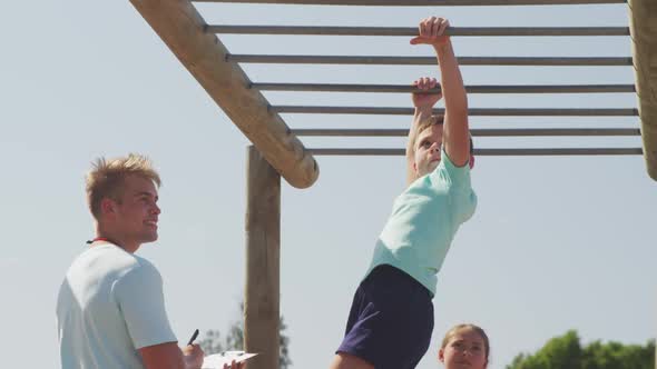 Caucasian boy training at boot camp