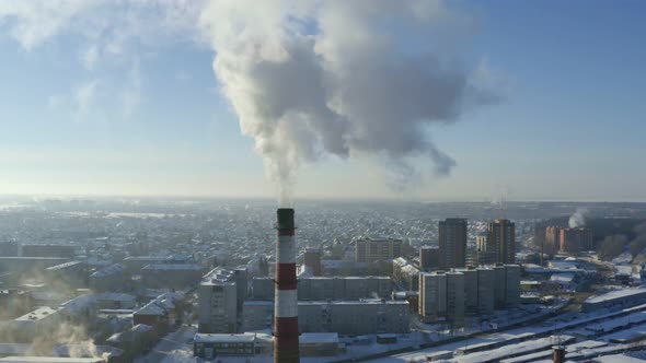 The plant emits smoke from the pipe, pollutants enter the atmosphere
