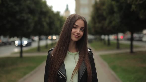 A Young Woman is Looking at the Camera