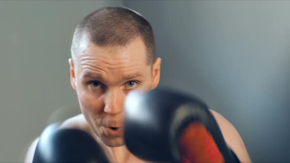 Young Male Athlete Training in Boxing Gym