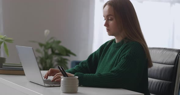 Young Female Boss Is Working in Her Office Room Sending Messages and Emails By Laptop Online Chat