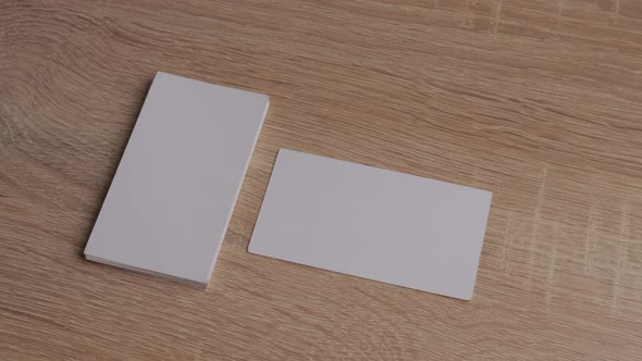 Blank White Paper Business Cards on Table