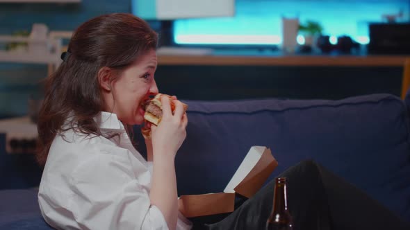 Caucasian Person Enjoying Free Time with Fast Food and Television