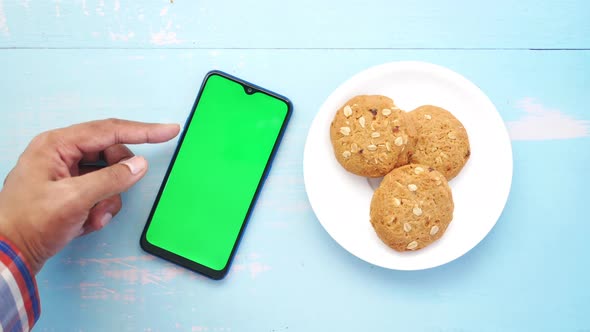 Top View of Man Hand Using Smart Phone on Office Desk