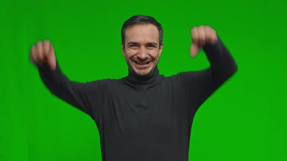 Excited Man Celebrating Success While Standing Over Yellow Background Happy Male Wining Reaching