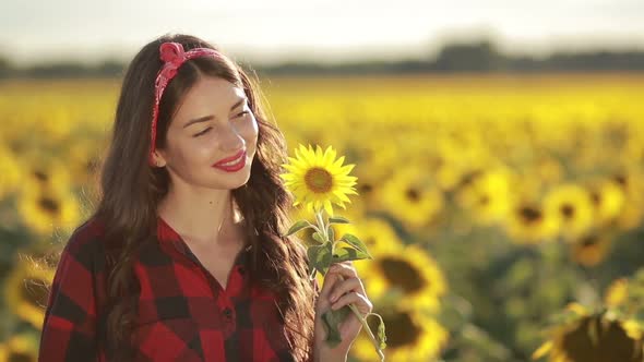 Sensual Smiling Woman Posing in Sunflower Field