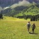 Man and woman hiking in mountain landscape, Alta Badia, Italy - VideoHive Item for Sale