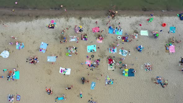 NOVOSIBIRSKRUSSIA June 9 2019Top View of the Beach Featuring Colorful Umbrellas and People Relaxing