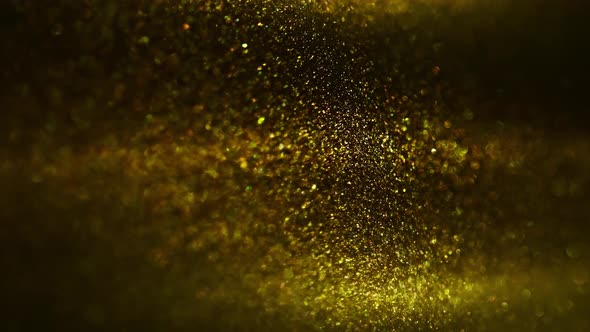 Golden Ink in Water Shooting with High Speed Camera. Gold Drops of Paint Dropped, Reacting, Creating