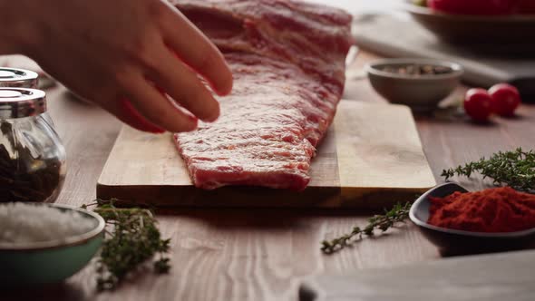 Woman Chef Cooking Ribs Closeup