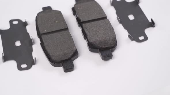 The Brake Pad Rotates Against a White Background