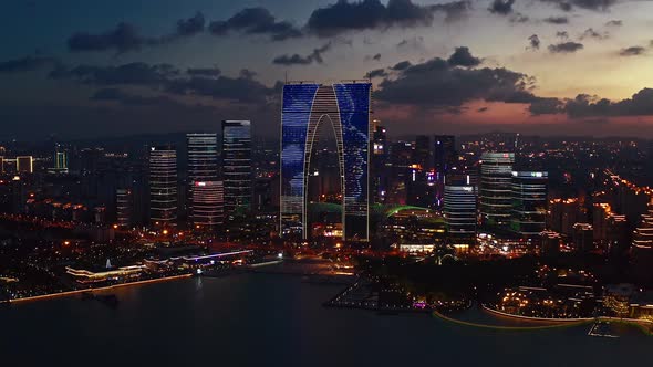 CBD buildings by Jinji Lake at night in Suzhou