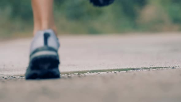 Runner Man Fit Athlete Legs Jogging On Trail Prepares To Triathlon. Triathlete Running, Sprinting.