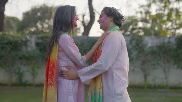 Happy romantic Indian couple on Holi occasion