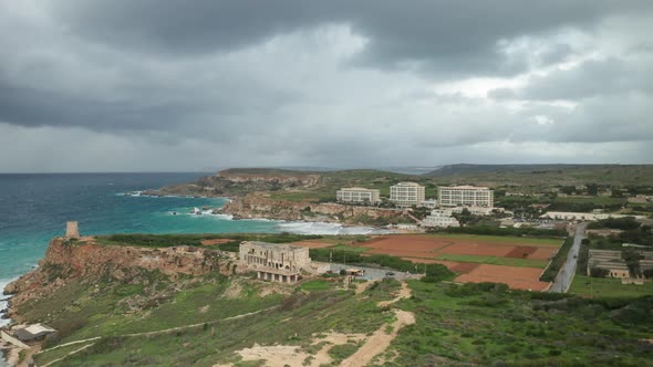 AERIAL: Flying to Golden Beach Above Farm Land On a Stormy Day