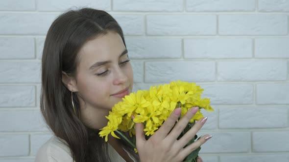 Beautiful girl with yellow flowers. 