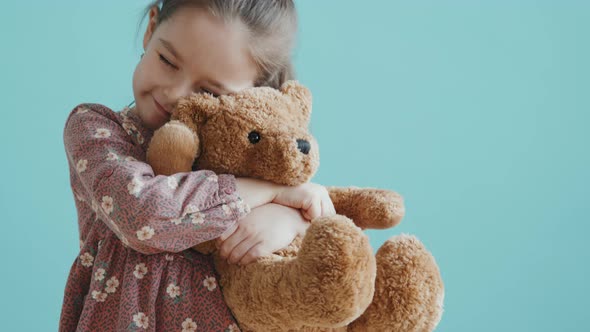 Slowmo of Little Girl Hugging Plushy