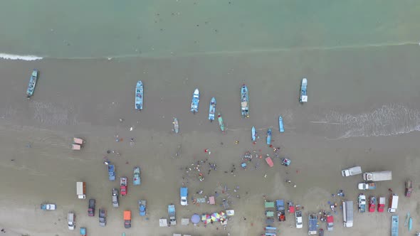 Aerial top view of fisherman that are selling their catch