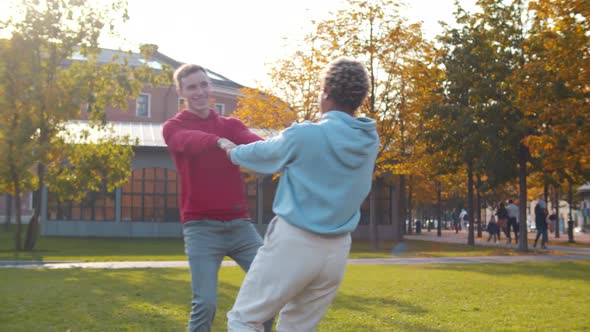 Cute Romantic Multiethnic Couple Spending Time Together in Autumn Park