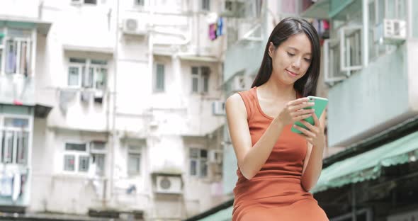 Woman use of mobile phone at outdoor 