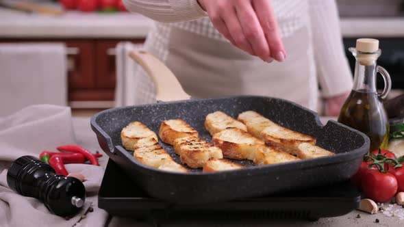 Toasting Slices of Baguette in a Grill Frying Pan