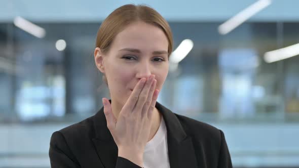 Portrait of Woman Giving Flying Kiss By Hands