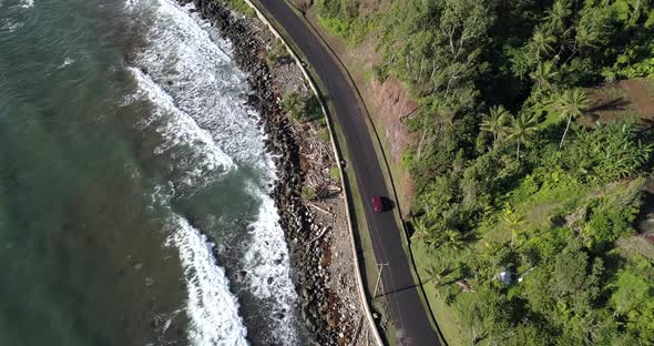 View Of The Road With A Passing Car And The Coast Of Dominica