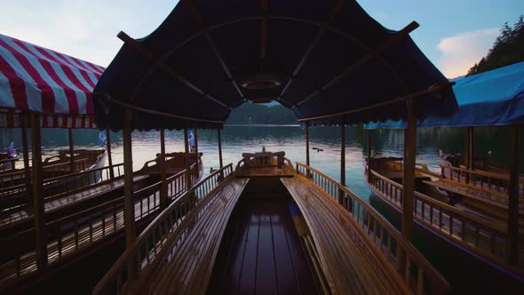 Traditional Wooden Pletna Boats Moored at Bled Lake at Twilight