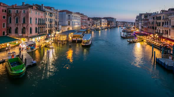 Grand Canal in Venice, Italy Day To Night Timelapse. View on Gondolas and City Lights From Rialto