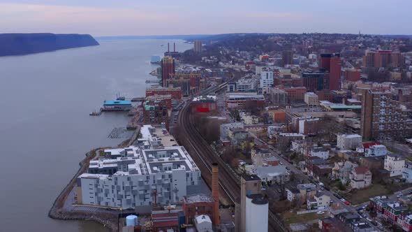 Aerial forward over Yonkers city near Hudson river, New York