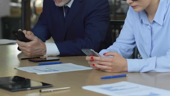 Business People Using Mobile Phones, Checking Price Growth on Stock Exchange