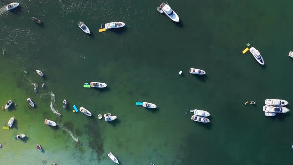  Aerial of White Yachts Sailing To the Shallow in Beautiful Light-green Waters
