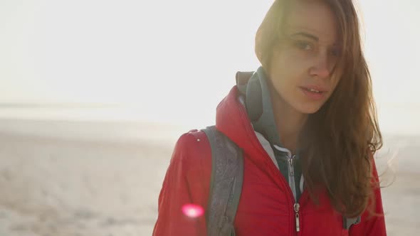 Slow Motion of Woman Traveler Meeting Sunrise at Sea Beach