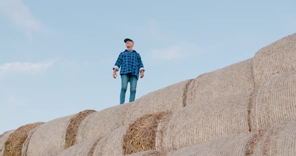 Successful Farming Concept, Positive Farmer Looking on Crops.