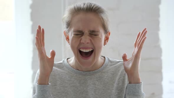 Shouting Screaming Young Woman in Anger at Work