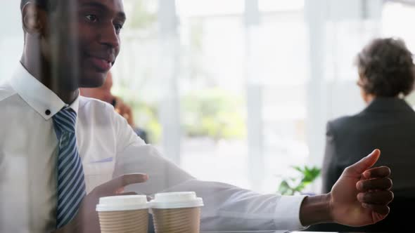 Businessman interacting with colleague