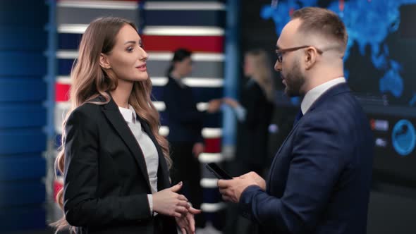 Stylish Woman Office Worker Talking with Male Boss at Stock Exchange Hi Tech Workspace