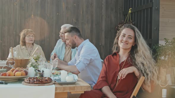 Woman Posing at Family Dinner Table