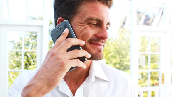 Handsome man talking on mobile phone