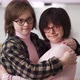 Two Happy Girls with Down Syndrome in Eyeglasses Standing Together Embracing - VideoHive Item for Sale