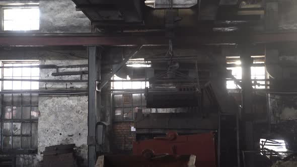 Factory overhead crane inside factory building. Factory room structure made from iron and steel.