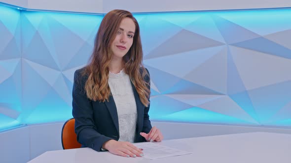 Girl TV Presenter Looking at the Camera and Smiling