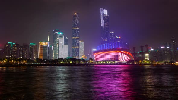 Guangzhou Night Business City Cityscape China Pearl River with Boats Traffic Timelapse Pan Up